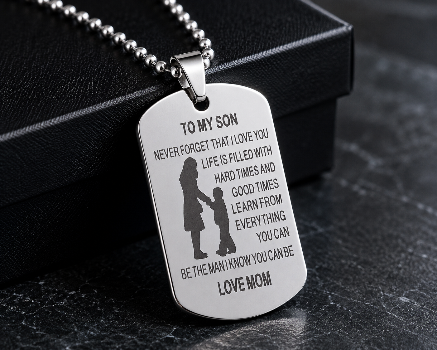 young man wearing a dog tag style necklace
